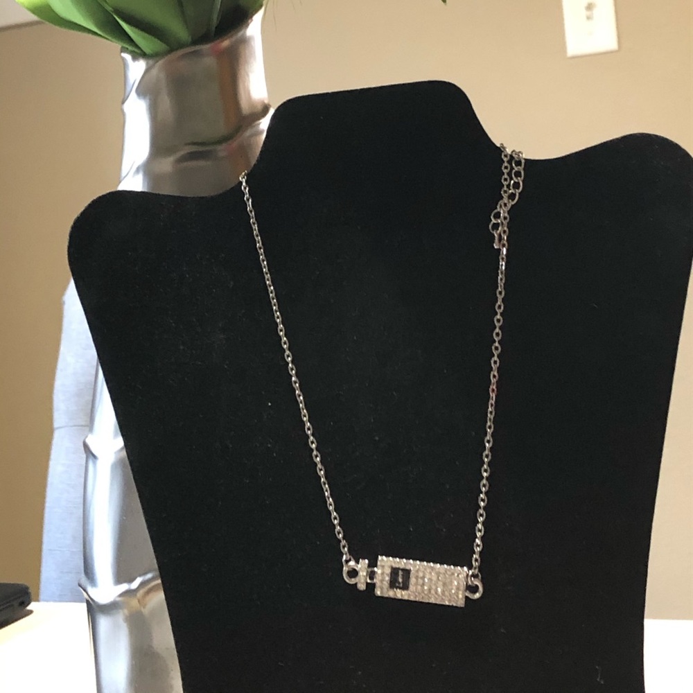 Silver necklace with perfume bottle shaped charm